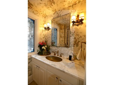 Powder rooms 'need to be charming because this is one area where guests are alone in your home,’ says designer Ernst Hupel, who created this fanciful papered room in a Victorian home.