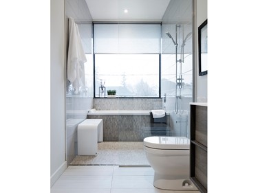 A large window overlooking the street was made possible in this ensuite by having the shower in the middle of the bathroom instead of being along the exterior/window wall (where it is typically placed), says Art House president Alex Diaz, who designed the space. Because of the shower’s position and its location on an upper floor, it’s not visible from the street; privacy is therefore a non-issue, although there is still a roller shade as a backup.