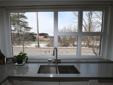 Best seat in the house: From the kitchen window, it’s a front-row view of the canal and Lansdowne Park beyond. 'When we are doing dishes ... people walk by and wave,' says the owner.