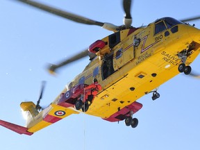 This file photo shows a Search and Rescue Technician hoisted down from a CH-149 Cormorant helicopter. Photo courtesy DND