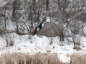 A homeless camp consisting of two tarp covered dwellings located alongside a creek that runs past the back of the Robert Guertin Arena. A girl was attacked on a path near the camp on Tuesday.