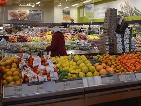 A shopper browses in a Loblaws produce section in Montreal.