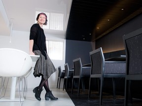 Heidi Helm, owner of Urbanomic Interiors, designed a dramatic dining room on the second floor of chef Marc Lepine’s Atelier restaurant. The new space features a clearly defined black-and-white theme: a sleek black bar on one side and a contemporary eating area on the other.