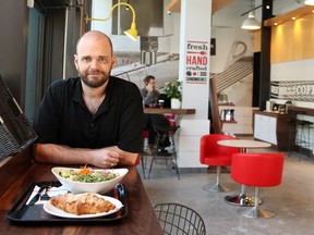 Alasdair Grant in his new shop, Aroma Espresso Bar, is seen with his Freekeh Salad and almond croissant.