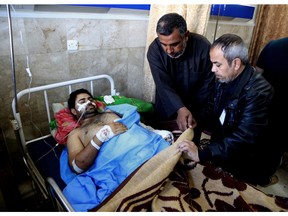 An injured victim of bombing attacks receives treatment at the Imam Ali Hospital in Sadr City, Baghdad, Iraq, Monday, Feb. 29, 2016.