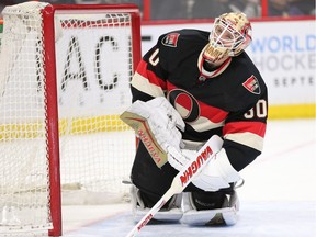 Andrew Hammond climbs back to his feet after the second goal in the second period as the Ottawa Senators take on the Tampa Bay Lightning in NHL action at the Canadian Tire Centre in Ottawa.