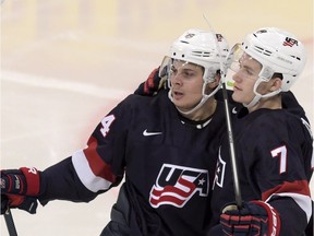 Auston Matthews, left, and Matthew Tkachuk of the U.S celebrate a goal during the 2016 IIHF World Junior Ice Hockey Championship bronze medal game between Sweden and the USA in Helsinki, Finland.