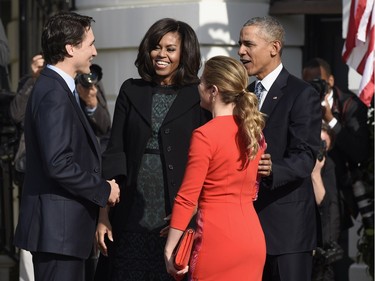 President Barack Obama and first lady Michelle Obama welcome Canadian Prime Minister Justin Trudeau and his wife Sophie Gregoire Turdeau to the White House in Washington, Thursday, March 10, 2016, during a state arrival ceremony on the South Lawn of White House.