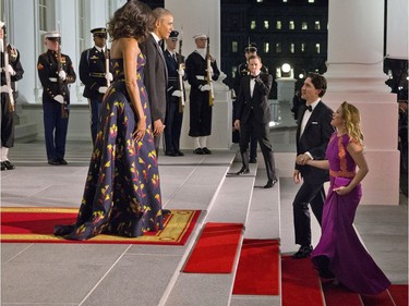 President Barack Obama and first lady Michelle Obama wait to greet Canadian Prime Minister Justin Trudeau and Sophie Gregoire Trudeau at the North Portico of the White House in Washington, Thursday, March 10, 2016, for a state dinner.
