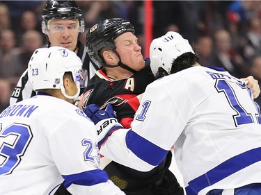 Chris Neil battles with Brian Boyle in the second period as the Ottawa Senators take on the Tampa Bay Lightning in NHL action at the Canadian Tire Centre in Ottawa.