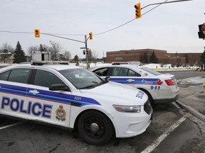 Ottawa Police investigate the city's 5th homicide of 2016 at the corner of Jasmine Crescent and Ogilvie Road in Ottawa last week.