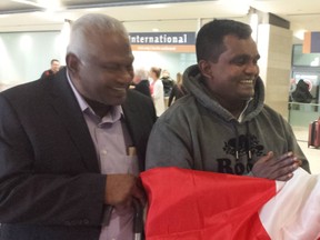 Colin Jayantha Perera, 65, left, greets nephew Lasantha Bandara, 40, at the Ottawa airport after he arrived from Sri Lanka to donate one of his kidneys to his uncle.