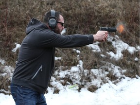 Ottawa city Councillor Jody Mitic fires his new handgun at the Stittsville Shooting Ranges Wednesday.