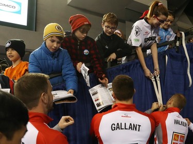 Curling players sign autographs for kids after the Tim Hortons Brier opening ceremony, March 05, 2016.