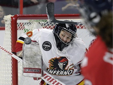 Calgary Inferno goaltender Delayne Brian (30) makes a blocker stop during first period of Canadian Women's Hockey League final action against Les Canadiennes de Montreal at the Clarkson Cup, Sunday March 13, 2016, in Ottawa.
