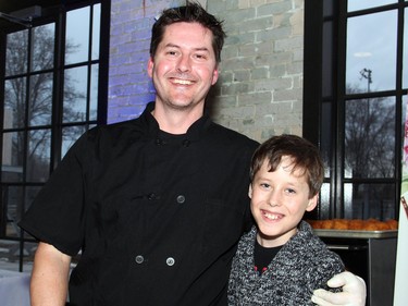 Essence Catering chef and owner Jason Laurin got help serving from his 11-year-old son Evan at the fourth annual A Taste For Hope culinary event held inside the Horticulture Building at Lansdowne on Wednesday, March 30, 2016, in support of the Shepherds of Good Hope.