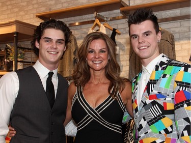Event coordinator Paula Thebarge with her sons, Tyler, 17, (left), and Brett, 20, both of whom volunteered at a benefit held at Shepherd's store in the Ottawa Train Yards shopping district on Tuesday, March 1, 2016.