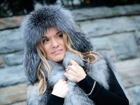 Marie-Josée Noury is cosy and chic wrapped in a delicate feathered grey fox vest and aviator-style leather and indigo fox hat from Tremblant’s Scada Furs. The three-carat Canadian diamond solitaire and white gold ring and 18-karat white gold and diamond bracelet is from Joaillerie St-Onge.