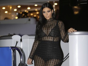 FILE - In this June 24, 2015 file photo, TV personality Kim Kardashian West poses during a photocall at the Cannes Lions 2015, International Advertising Festival in Cannes, southern France. Kardashian engaged in a Twitter battle with 19-year-old, actress Chloe Grace Moretz who criticized Kardashian's nude selfie.
