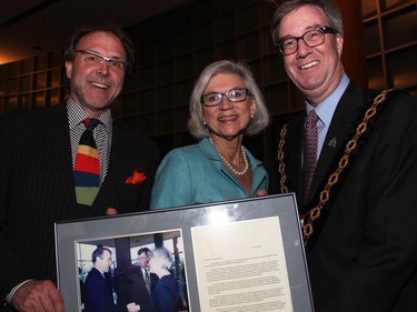 From left, lawyer Warren Creates brought along his framed photo, from June 2000, of himself first meeting Chief Justice Beverley McLachlin with Mayor Jim Watson, to the presentation of the Key to the City to McLachlin at Ottawa City Hall.