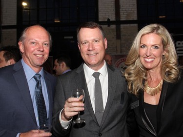 From left, Rob Searle, chief financial officer for the Shepherds of Good Hope with its foundation board chair, lawyer John Peters, and fellow board member Melissa Shabinsky, at the fourth annual A Taste For Hope culinary benefit held at the Horticulture Building at Lansdowne on Wednesday, March 30, 2016.