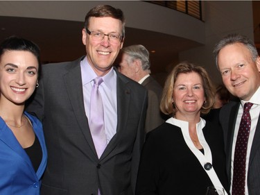 From left, University of Ottawa law student Stephanie Dragoman and Jim McArdle, senior vice president with Export Development Canada, were seen chatting with Valerie Poloz and her husband, Bank of Canada Governor Stephen Poloz at Ottawa City Hall on Tuesday, March 22, 2016, following the presentation of the Key to the City to Supreme Court Chief Justice Beverley McLachlin.