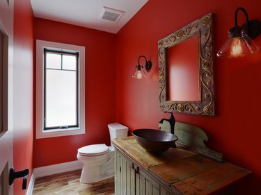 The powder room can also be that room to go wild, especially if you're nervous about making a bold statement elsewhere in your home. This Granville Avenue one by Chuck Mills Residential Design & Development and Amsted Design-Build certainly does not shy away from colour.