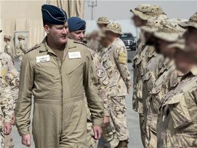 Lieutenant-General Michael Hood, Commander of the Royal Canadian Air Force, inspects the troops during the Operation IMPACT Mission Transition Parade, in Kuwait, on March 5, 2016. DND photo.
