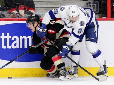 Jean-Gabriel Pageau battles with Nikita Nesterov along the boards in the first period as the Ottawa Senators take on the Tampa Bay Lightning in NHL action at the Canadian Tire Centre in Ottawa.