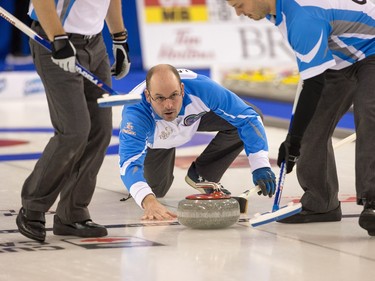 Jean-Michel Ménard of Quebec watches his last shot against Northern Ontario as the Tim Horton's Brier continues on Sunday at TD Place in Ottawa.