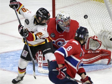 Calgary Inferno's Jessica Campbell (20) watches her shot go in the net past Les Canadiennes de Montreal goalie Charline Labonte (32) during the third period of Canadian Women's Hockey League final action at the Clarkson Cup, Sunday March 13, 2016, in Ottawa.