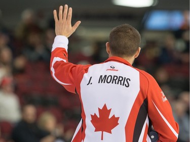 John Morris of Team Canada waves to the crowd after winning their draw against Saskatchewanas the Tim Horton's Brier continues on Sunday at TD Place in Ottawa.