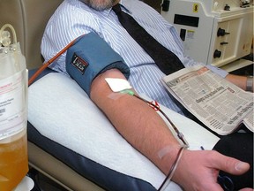 John Wittkamp donates plasma for the 778th time at the Canadian Blood Services headquarters. Wittkamp is a member of a group of eight London Life employees who have donated 2,400 units during the last 12 years. The group's milestone donation was honoured yesterday, helping to kick off the 2008 holiday campaign in which the CBS is hoping to collect 81,000 units of blood, plasma and platelets, 15,900 of them from Southern Ontario.