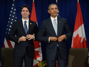 Canadian Prime Minister Justin Trudeau, left, takes part in a bilateral meeting with U.S. President Barack Obama at the APEC Summit in Manila, Philippines on Thursday, November 19, 2015.