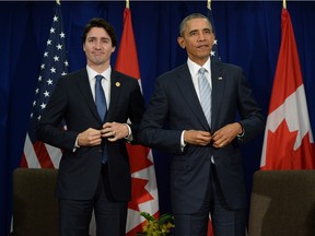 Canadian Prime Minister Justin Trudeau, left, takes part in a bilateral meeting with U.S. President Barack Obama at the APEC Summit in Manila, Philippines on Thursday, November 19, 2015.