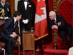 Prime Minister Justin Trudeau, left, speaks with Governor General David Johnston following the speech from the throne Dec. 4, 2015. How will the budget reflect his plan?