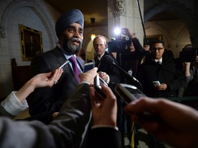Minister of National Defence Minister Harjit Singh Sajjan speaks to reporters following a cabinet meeting on Parliament Hill in Ottawa on Tuesday, Feb. 16, 2016. THE CANADIAN PRESS/Sean Kilpatrick
