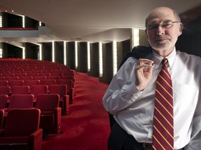 NAC CEO Peter Herrndorf
stands inside Southam Hall as it appears today. The red seats and the red carpet will be replaced by fall.