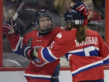 Les Canadiennes de Montreal Marie-Philip Poulin (29) celebrates with teammate Lauriane Rougeau (5), right, during first period of Canadian Women's Hockey League final action at the Clarkson Cup, Sunday March 13, 2016, in Ottawa.
