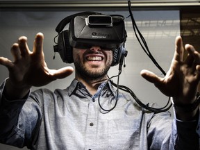 Matt Thomas, head of business development at SimWave, shows off the company's virtual reality "experience" box that allows people to live through the storming of Juno beach in their Kanata office, Tuesday, March 1, 2016. (Darren Brown) Assignment: 122989