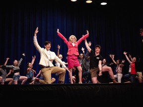 Matteo Ferrara Vodicka (L), performs as Aaron Schultz, Hannah El-Emam (2ndFL), performs as Elle Woods, Francis Coulombe (R), performs as Kyle B. O'Boyle, during Colonel By Secondary School's Cappies production of Legally Blonde - The Musical