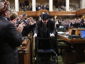 Liberal MP Mauril Belanger gets  a standing ovation as he makes his way to the Speaker's Chair in the House of Commons.