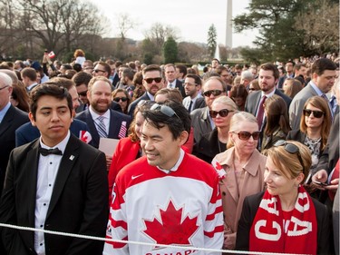 Members of the audience gather on the South Lawn before President Barack Obama greets Canada's Prime Minister Justin Trudeau, for an arrival ceremony at the White House in Washington, Thursday, March 10, 2016.