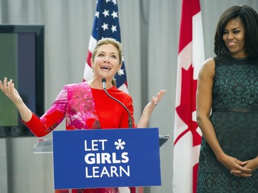 First lady Michelle Obama listens as Sophie Grégoire-Trudeau, wife of Canadian Prime Minister Justin Trudeau, speaks during a program at the U.S. Institute of Peace in Washington, Thursday, March 10, 2016, to highlight Let Girls Learn efforts and raise awareness for global girl's education.