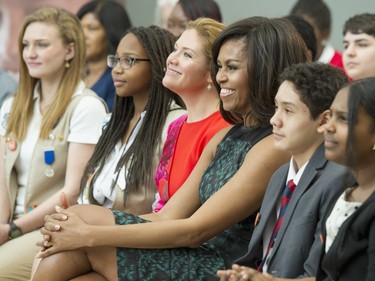 First lady Michelle Obama and Sophie Grégoire-Trudeau, wife of Canadian Prime Minister Justin Trudeau, sing with school children as they participate in a program at the U.S. Institute of Peace in Washington, Thursday, March 10, 2016, to highlight Let Girls Learn efforts and raise awareness for global girl's education.