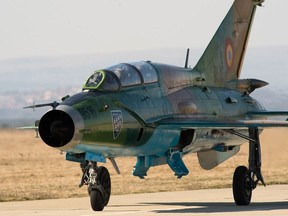 A Romanian MiG-21 taxis off the runway after a training sortie at Campia Turzii, Romania, March 17, 2015. Romanian and 480th Fighter Squadron Airmen trained together with more than 100 personnel from U.S. Air Force bases in Germany to establish a forward base and conduct operations from it. (U.S. Air Force photo/Staff Sgt. Armando A. Schwier-Morales)