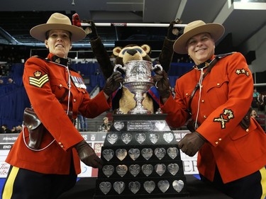 Mounties take care of the Tim Hortons Brier trophy at TD Place in Ottawa, March 05, 2016.