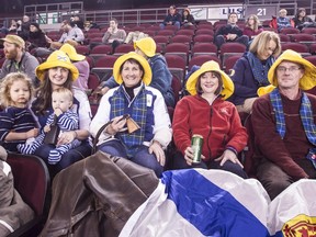 Nova Scotia Brier skip Jamie Murphy's family and friends donned Sou'westers to watch the maritime foursome defeat Yukon, 11-3, in the opening game of the relegation round on Thursday night at Lansdowne Park. From left are Murphy's wife, Grace, and their children, Alice and Nolan; his mother, Jill, aunt Meta and father, Mike Murphy.