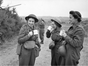 Nursing sisters of No. 10 Canadian General Hospital, Royal Canadian Army Medical Corps (R.C.A.M.C.), having a cup of tea upon arriving at Arromanches, France, 23 July 1944.