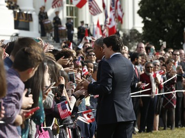 President Barack Obama and Canadian Prime Minister Justin Trudeau, greet guests on the South Lawn of the White House on Trudeau's arrival, Thursday, March 10, 2016 in Washington,